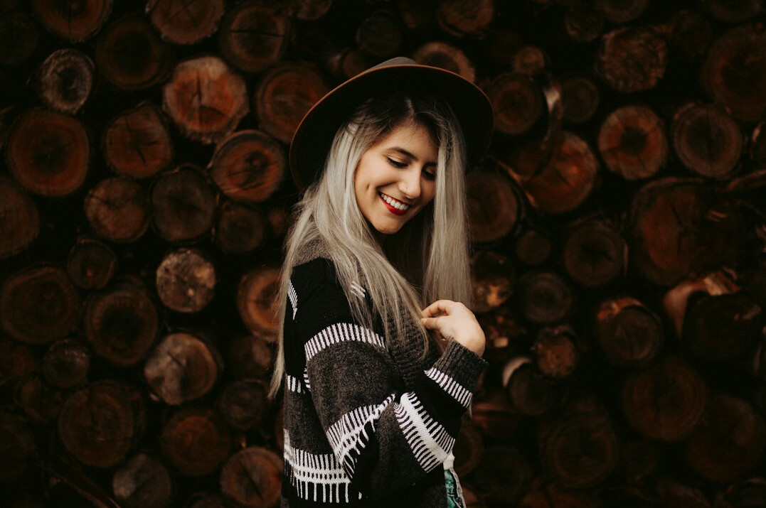 Smiling Brazilian woman in a casual sweater looking at the camera