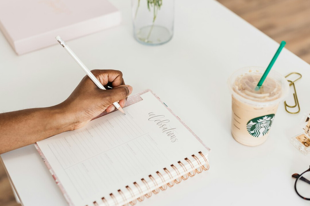 person journaling at desk