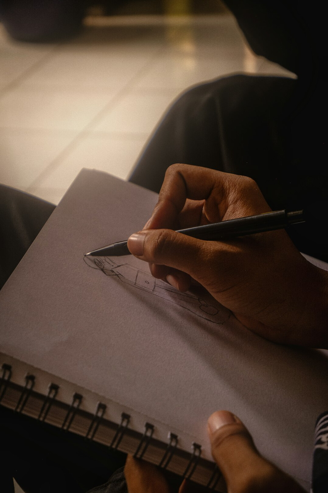 person writing in notebook