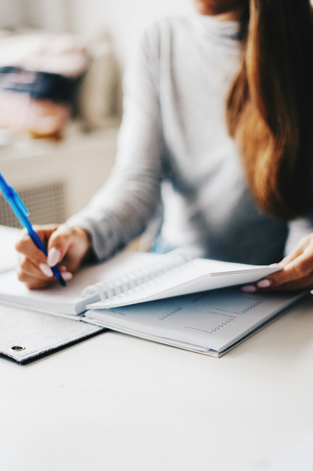 person setting goals notebook